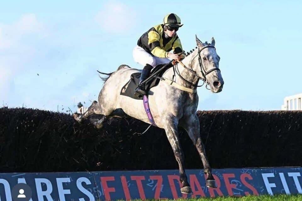 A Joe Tickle Racing runner jumping a fence