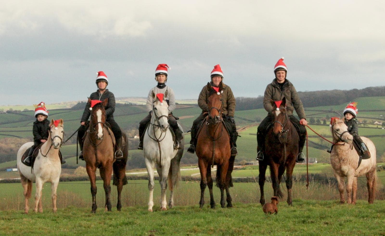 Joe Tickle Racing team out riding, decked out in Christmas hats